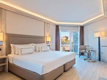 a bedroom with a bed and a table