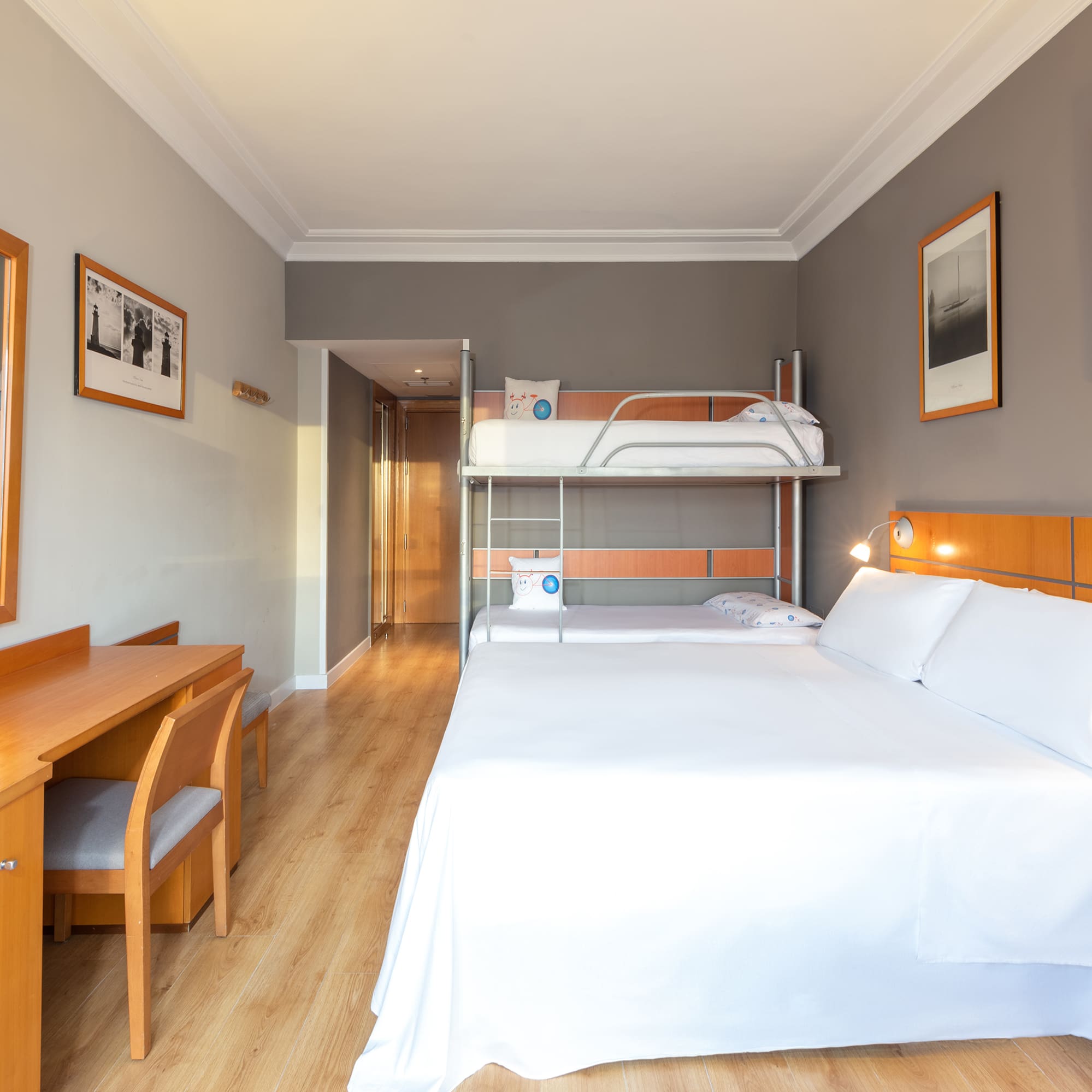 a room with a bunk bed and a desk