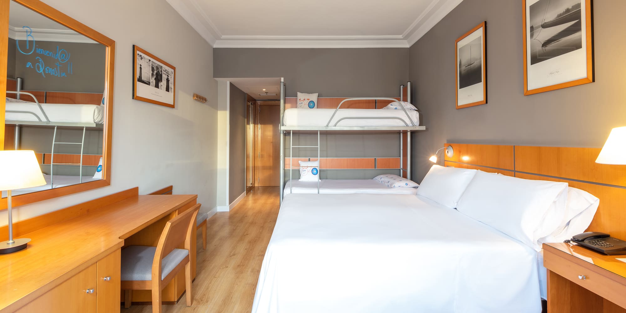 a room with a bunk bed and a desk