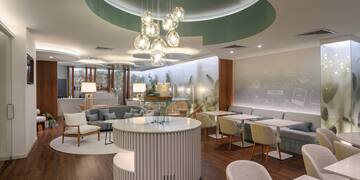 a room with a round table and chairs