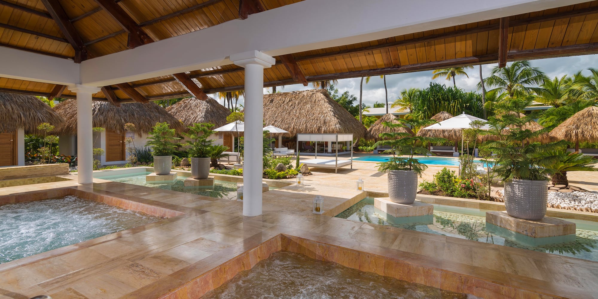 a pool with hot tubs and a pool in the middle