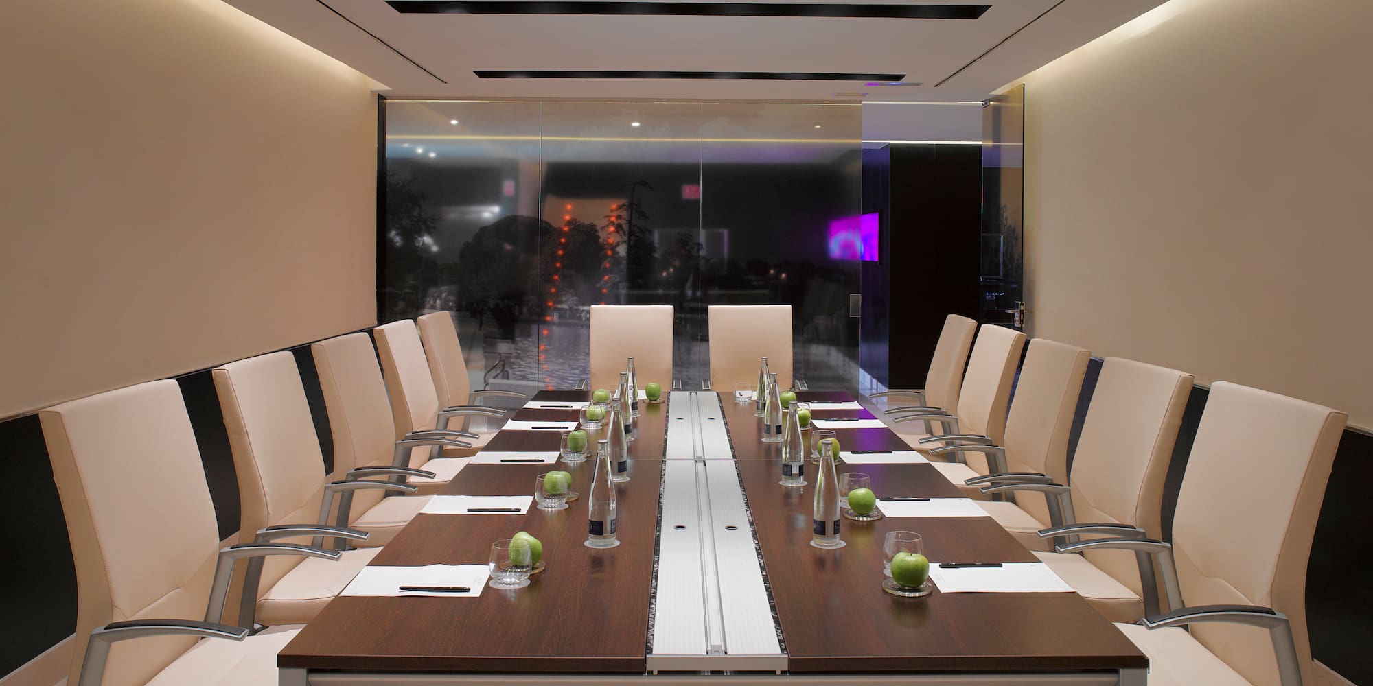 a conference room with a table and chairs
