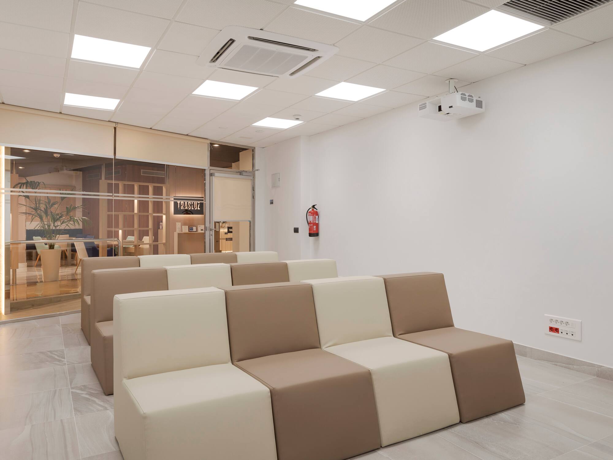 a room with white and brown chairs