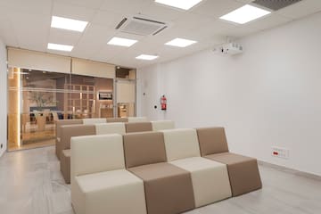 a room with white and brown chairs