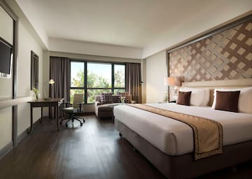 a room with a bed and a chair