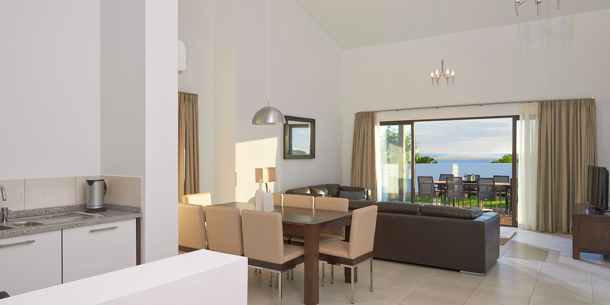 a living room with a table and chairs