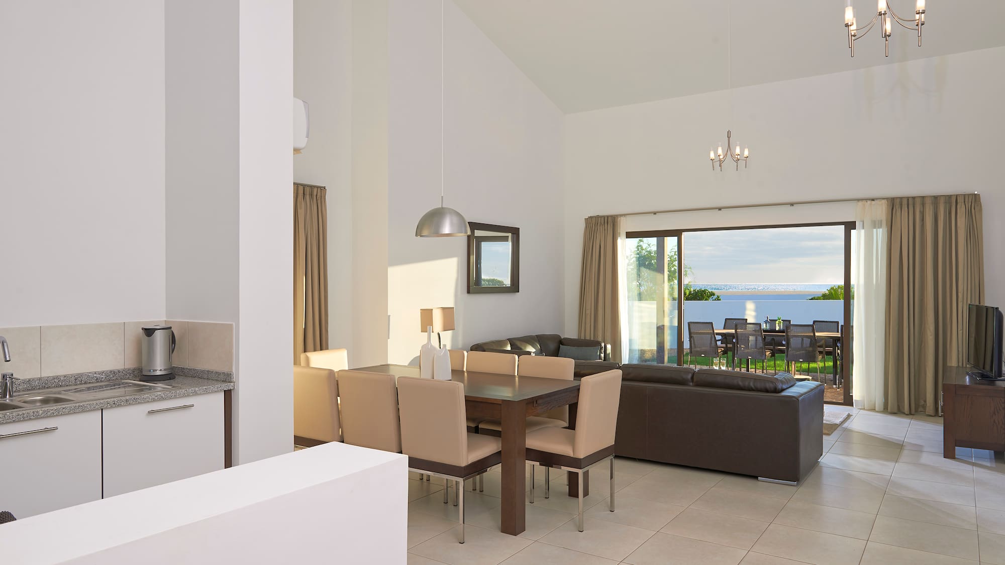 a living room with a table and chairs