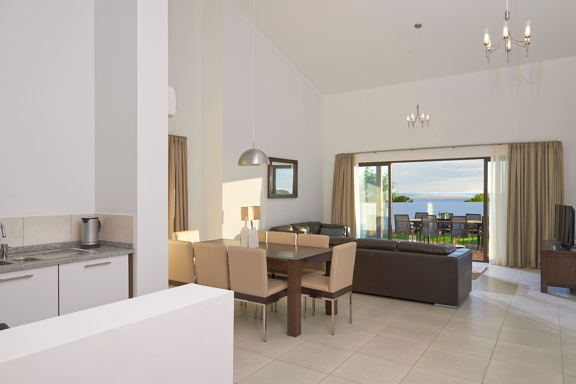 a living room with a table and chairs