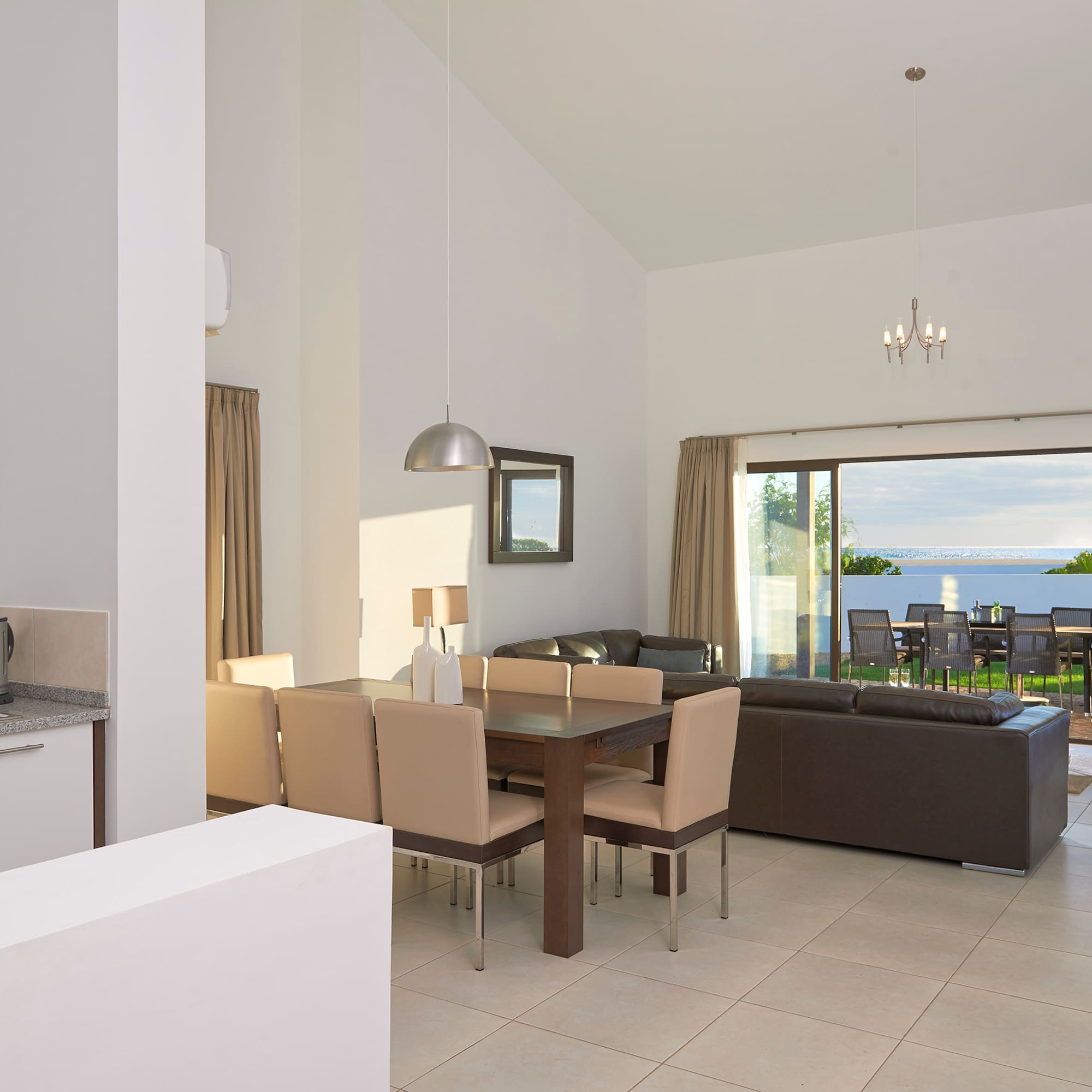 a living room with a table and chairs