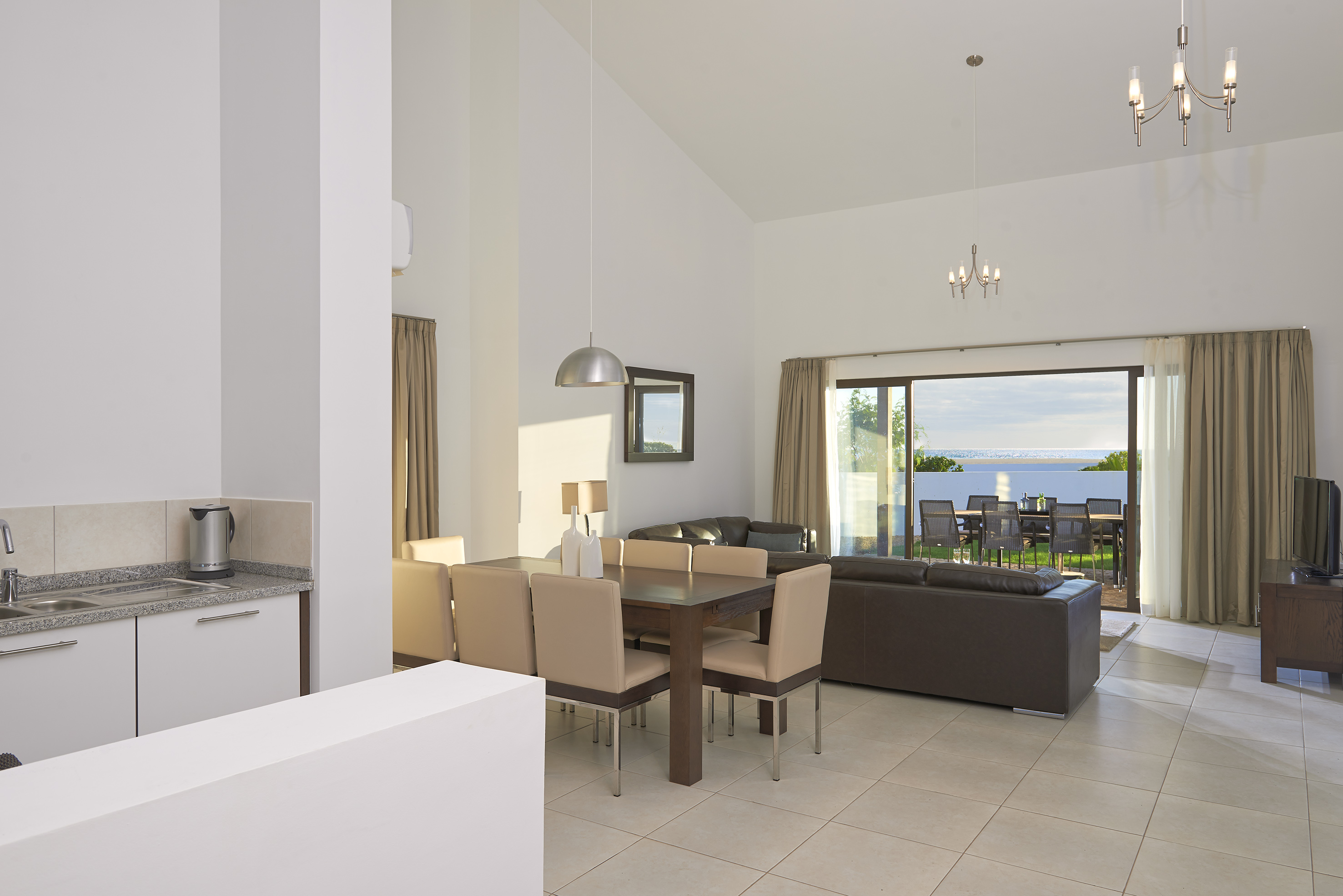 a living room with a table and chairs