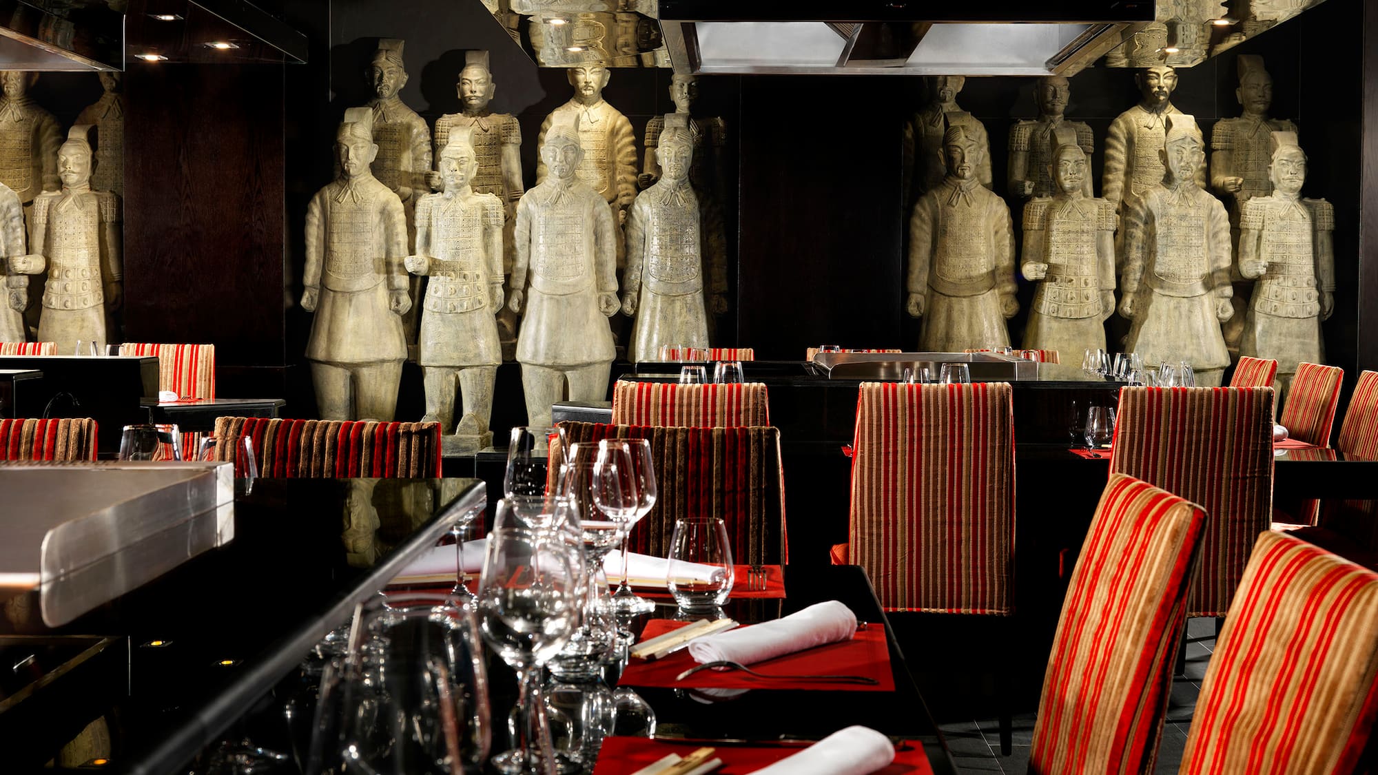 a restaurant with statues of men