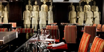 a restaurant with statues of men