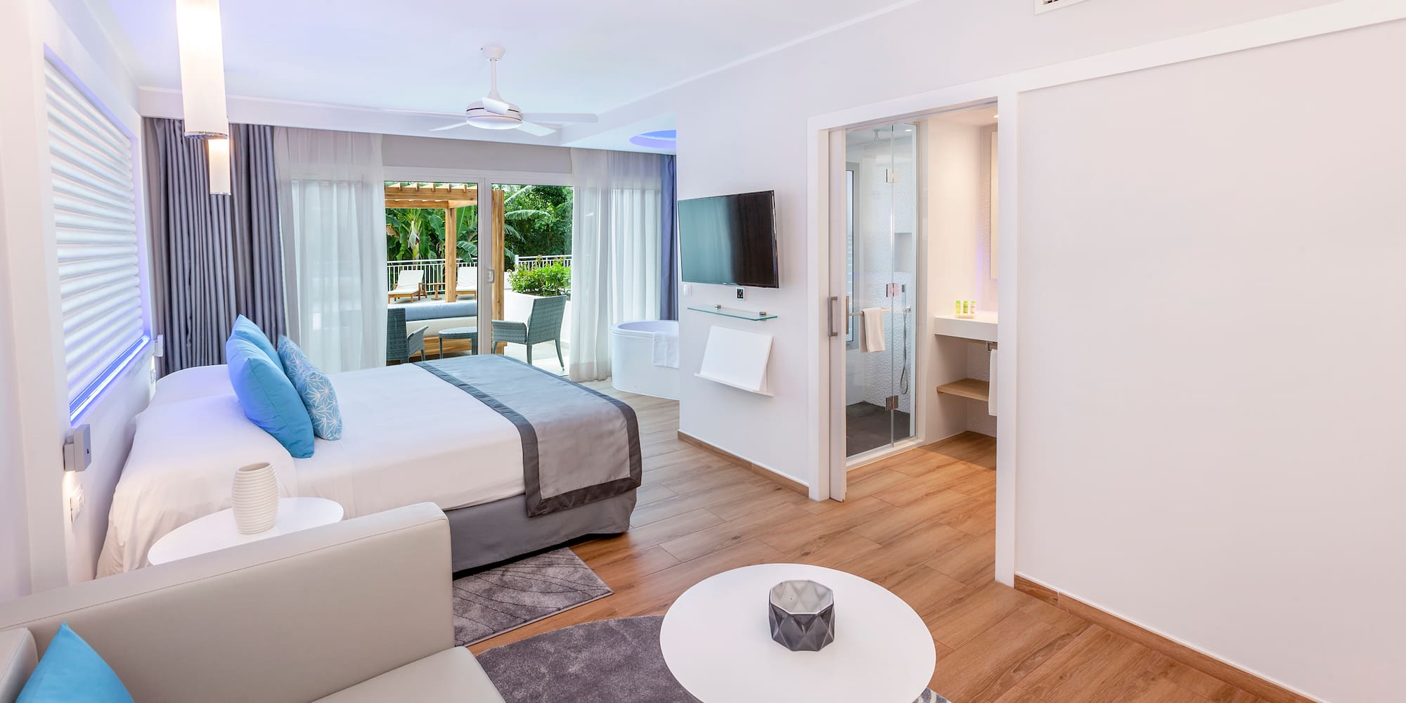 a bedroom with a bed and a television