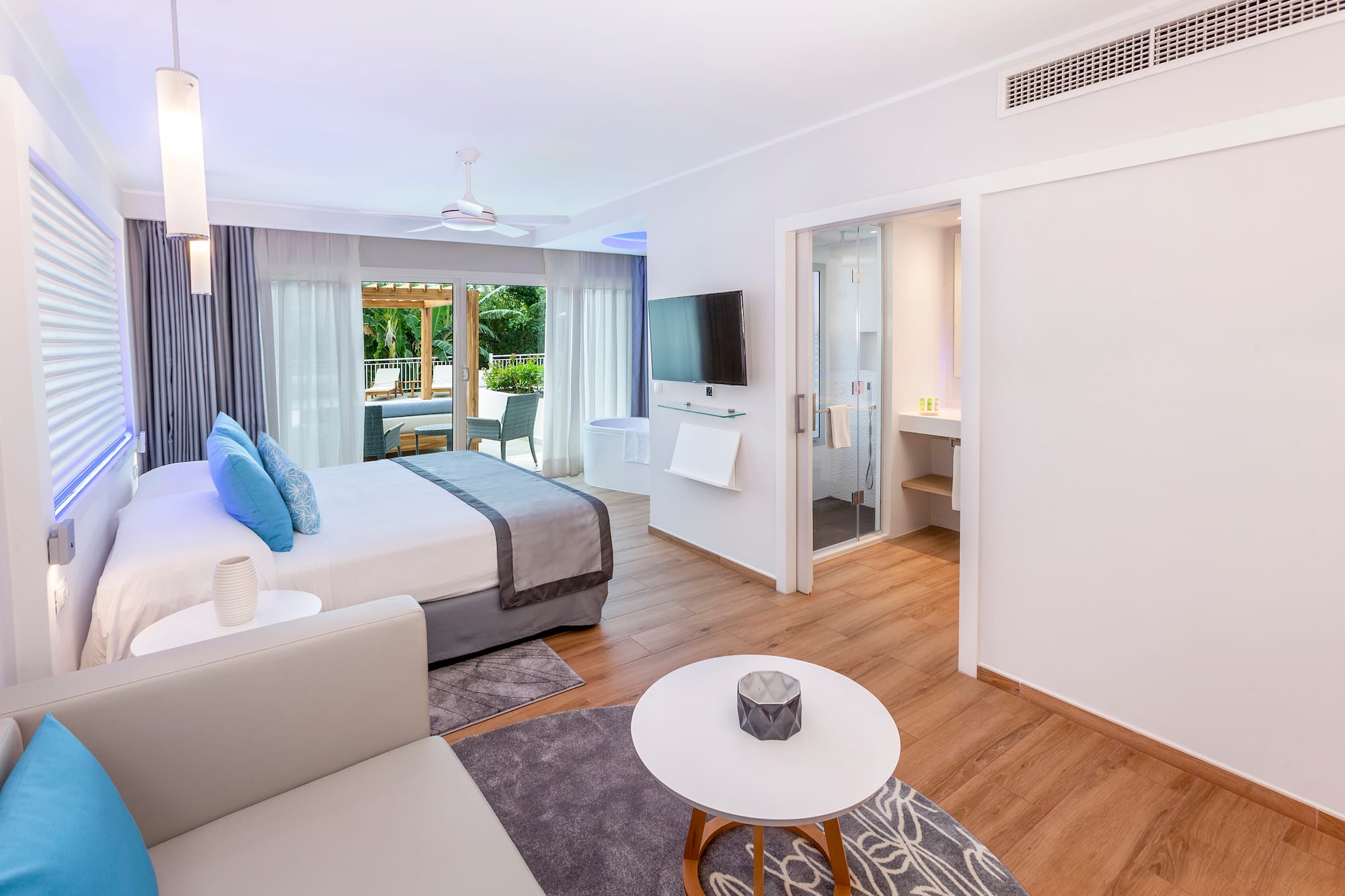 a bedroom with a bed and a television