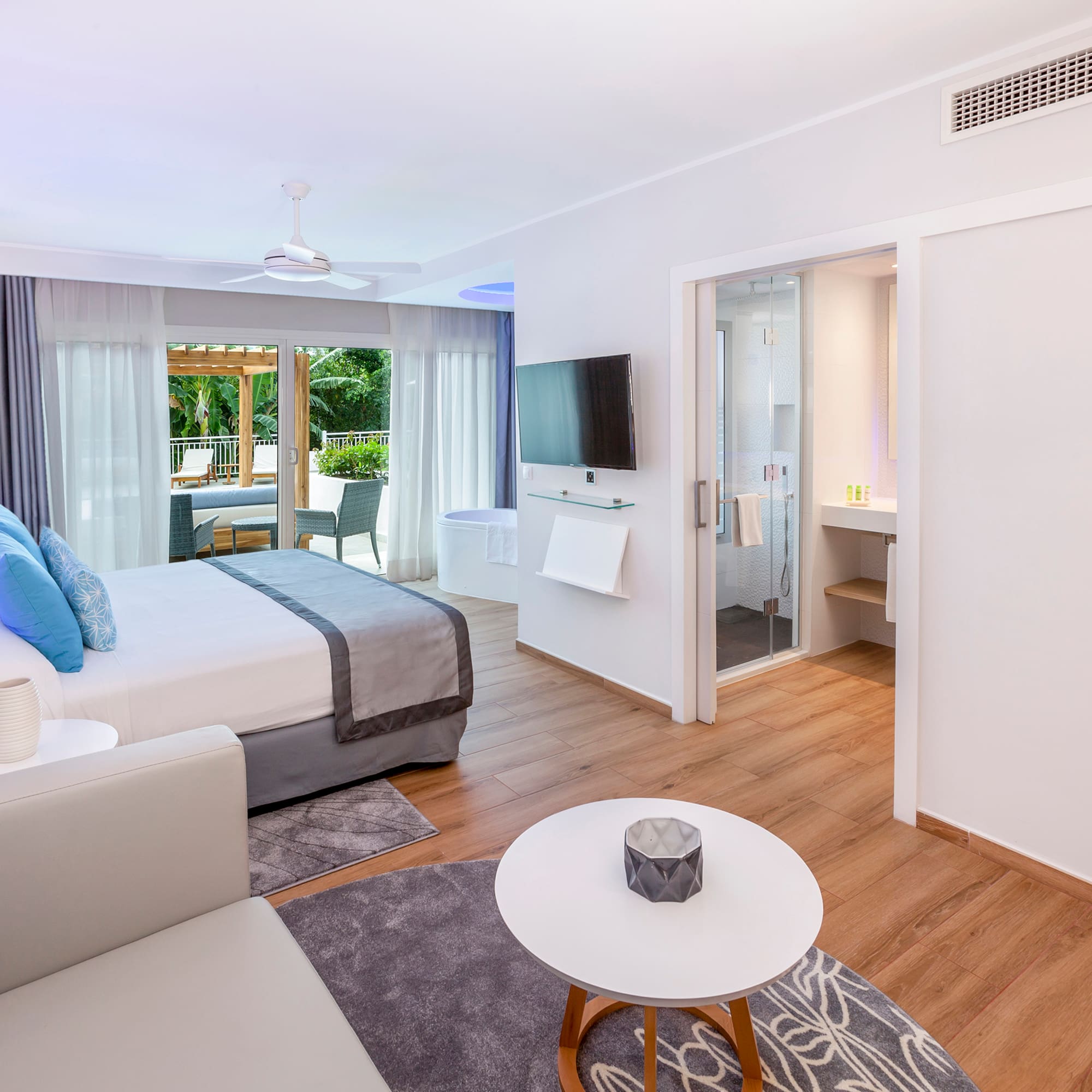 a bedroom with a bed and a television