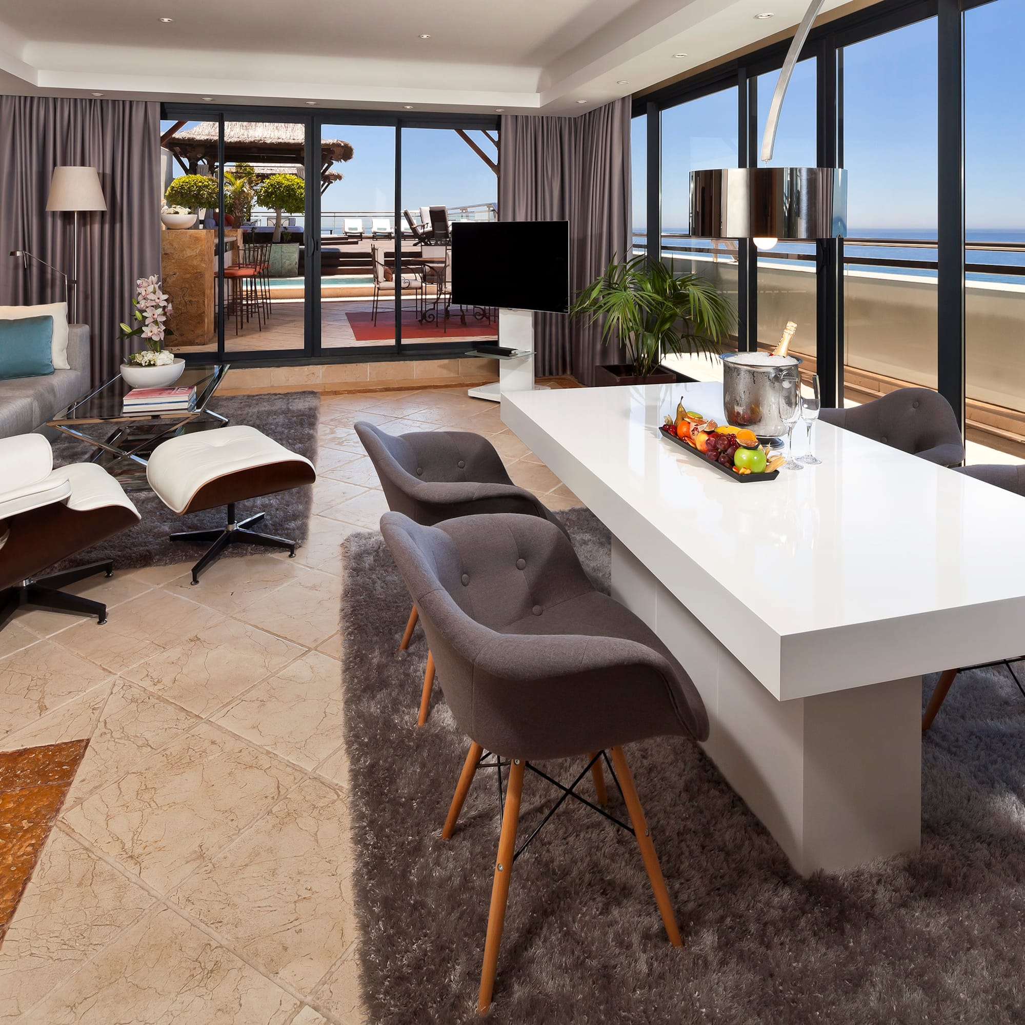 a room with a large table and chairs