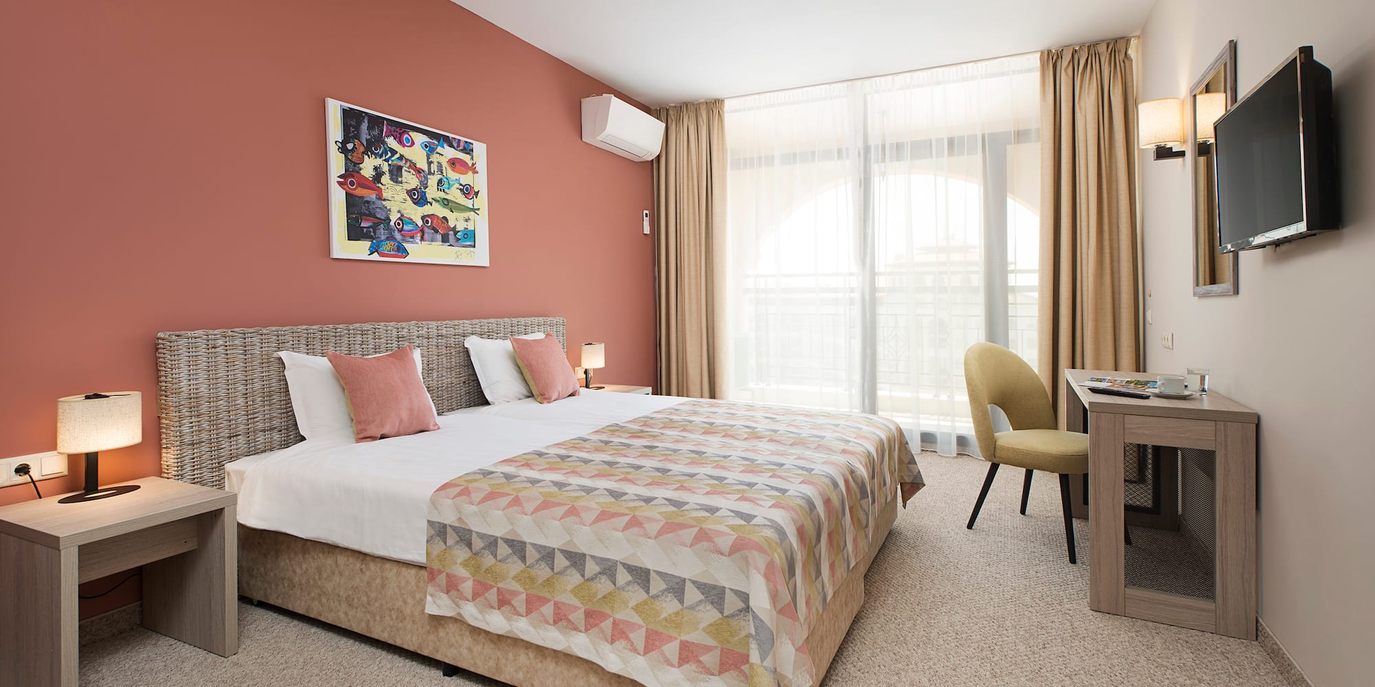 a bedroom with a bed and a desk