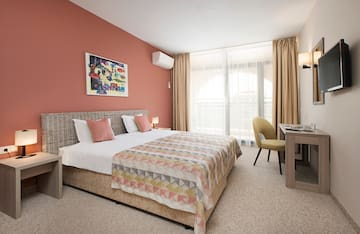 a bedroom with a bed and a desk