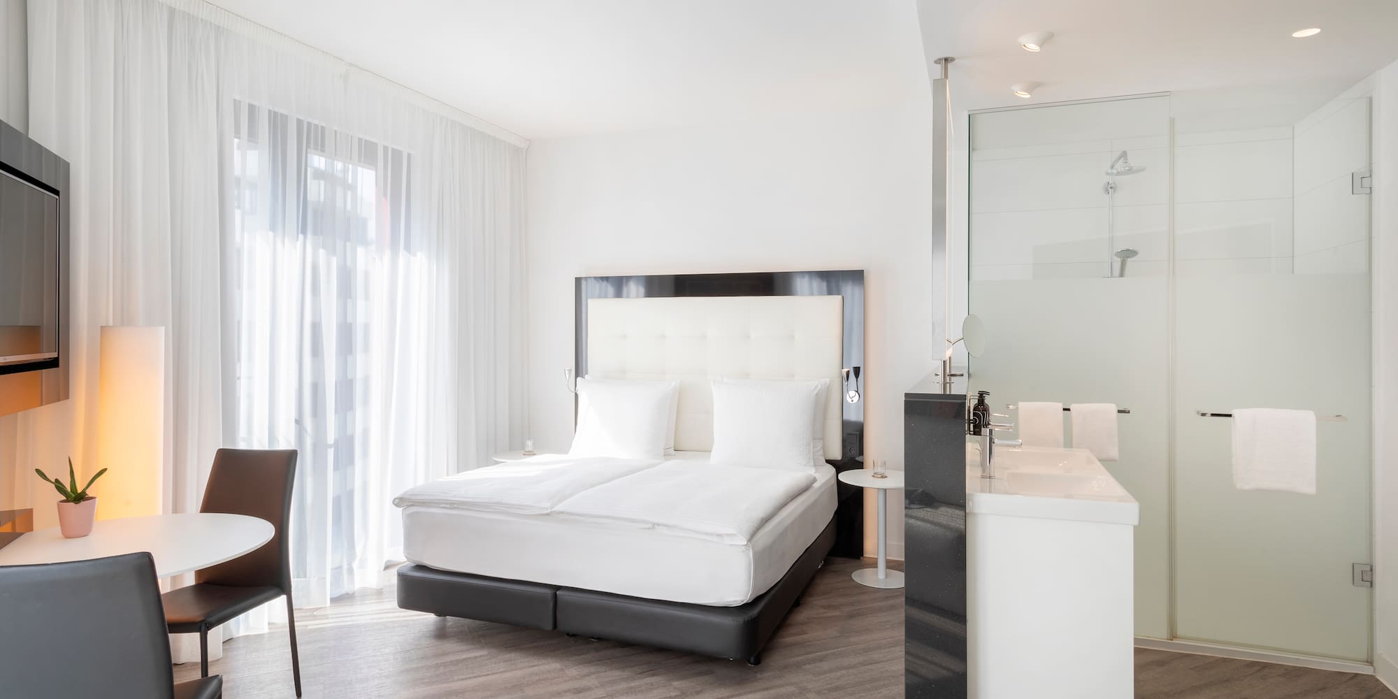 a room with a bed and a sink