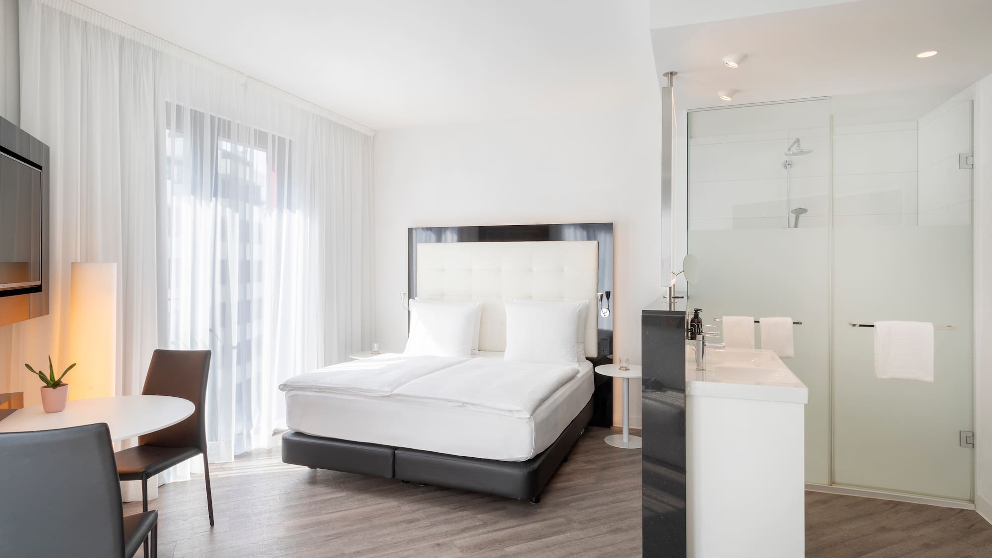 a room with a bed and a sink