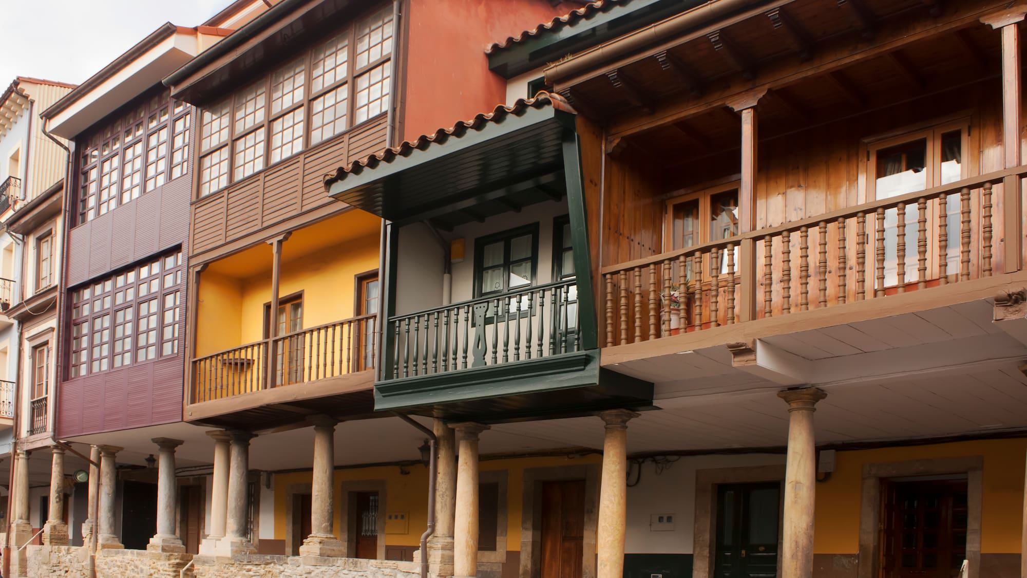 a row of multistory buildings with columns