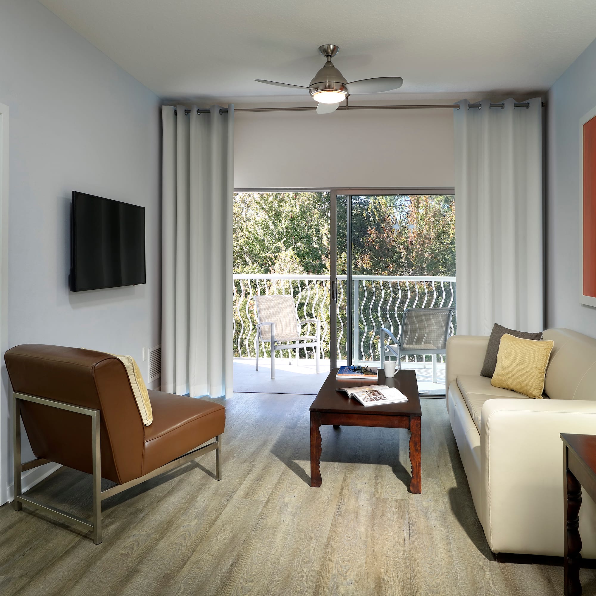 a living room with a television and couches