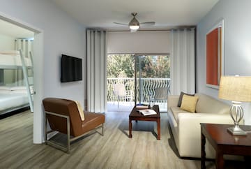 a living room with a television and couches