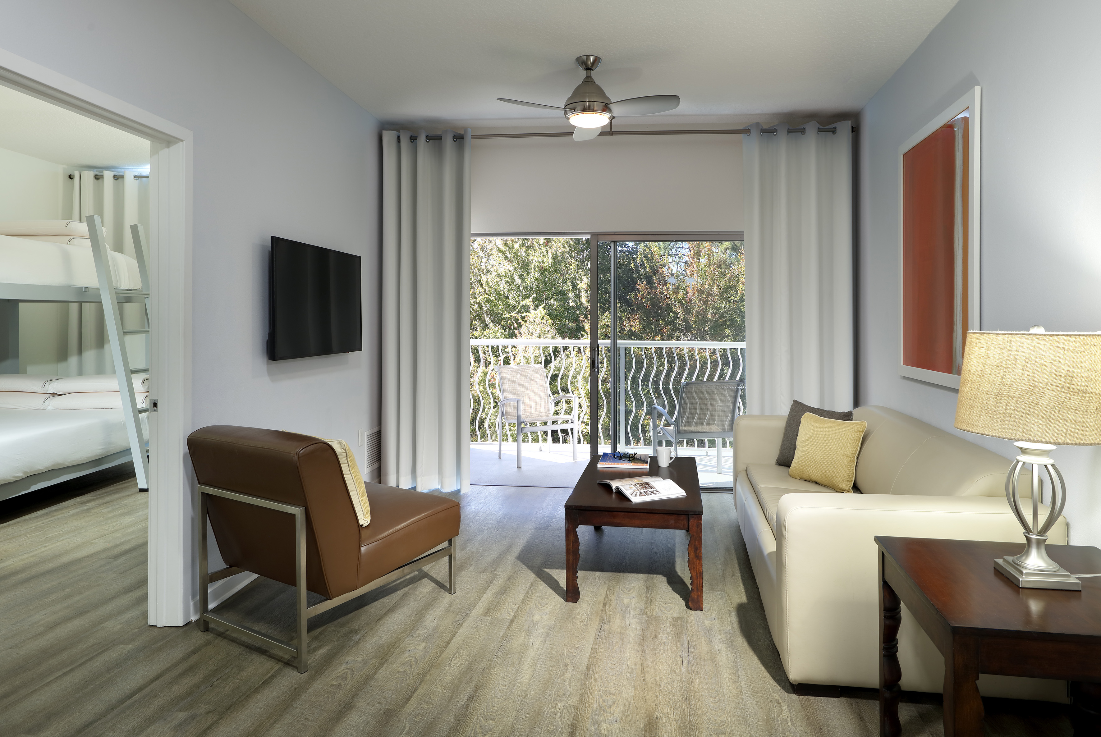 a living room with a television and couches