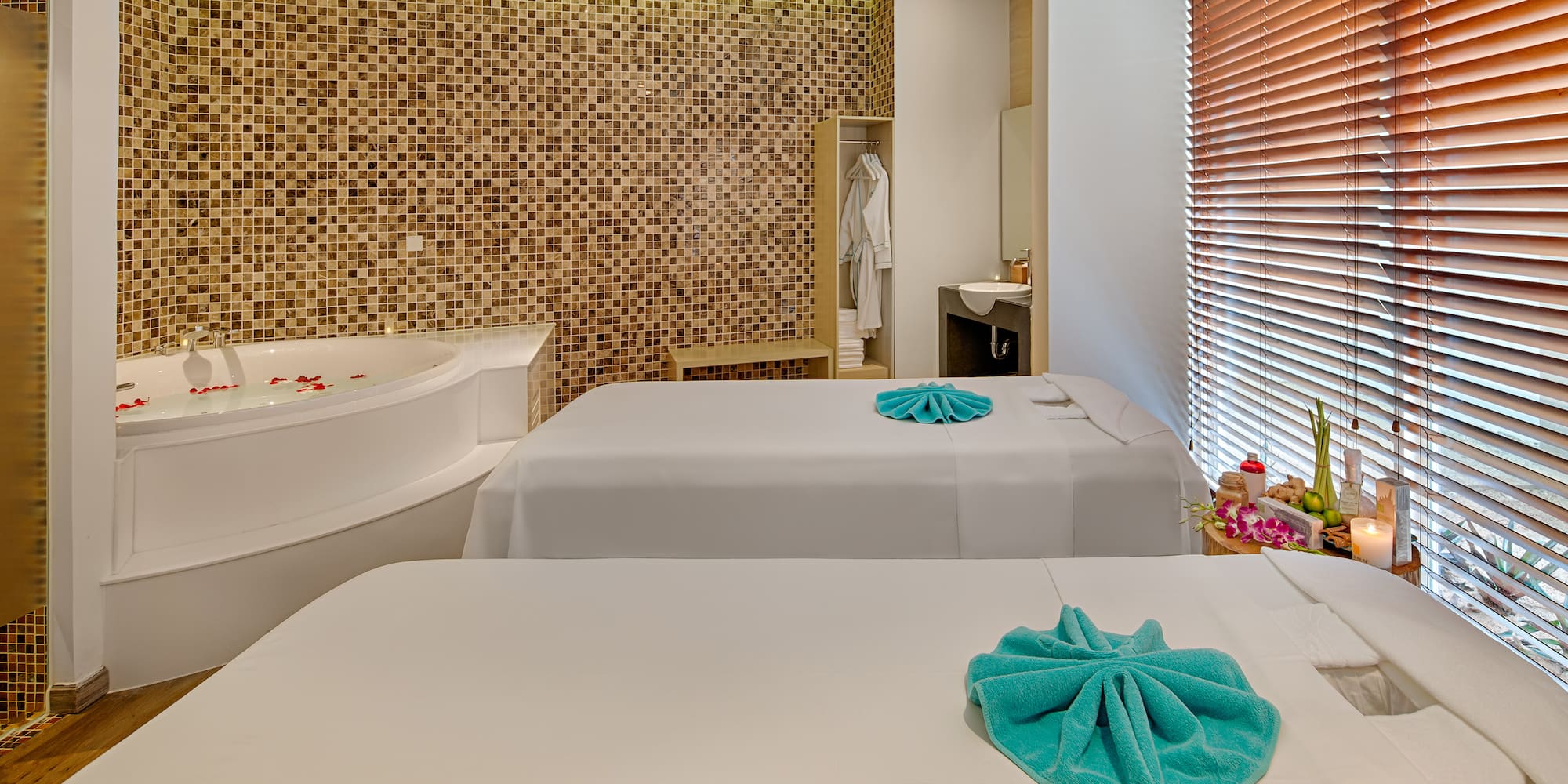 a room with two beds and a jacuzzi