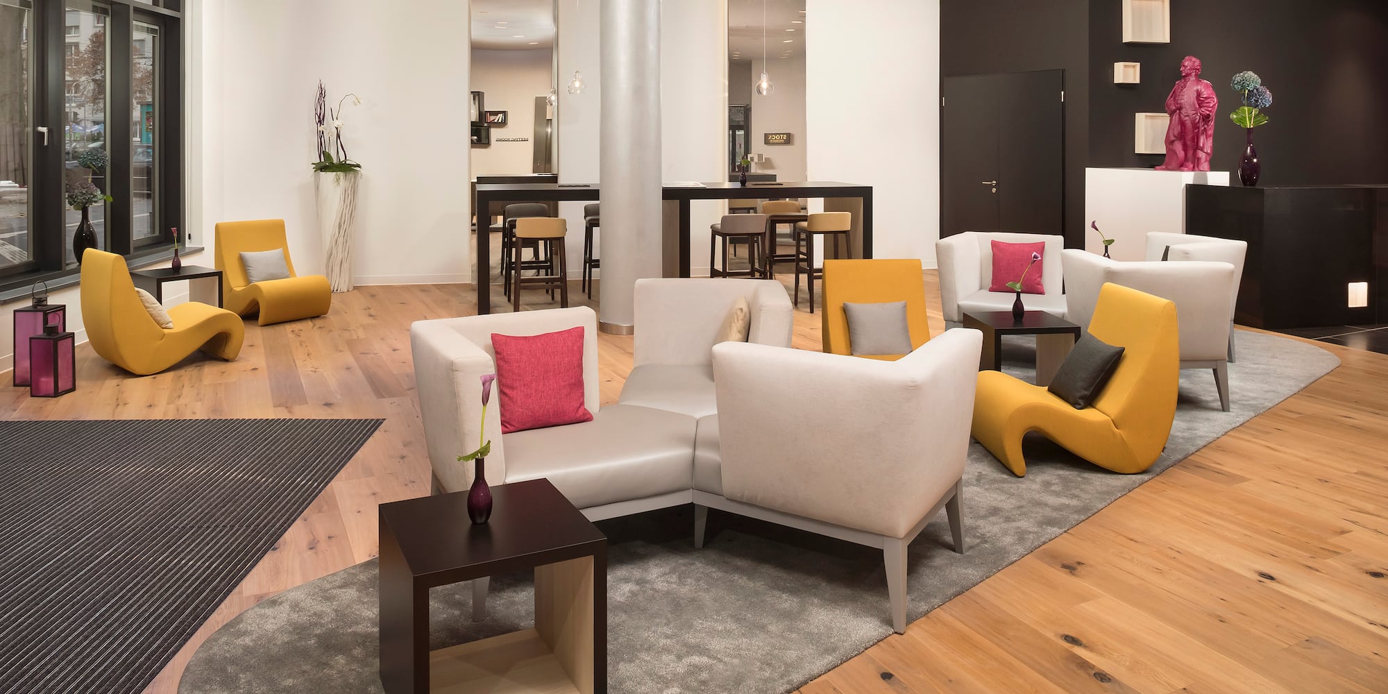 a room with a couch and chairs