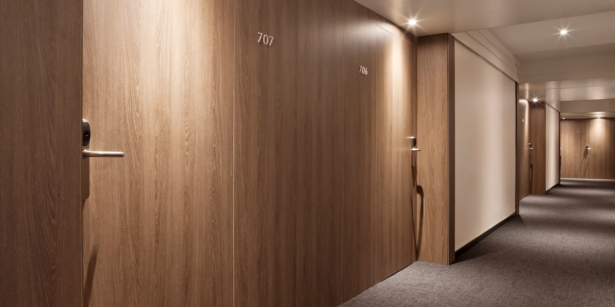 a hallway with doors and a door handle