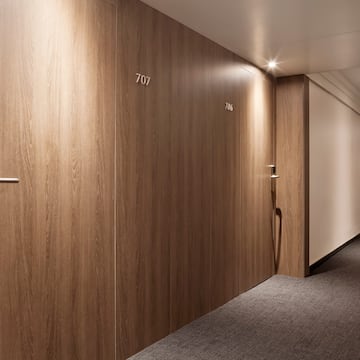 a hallway with doors and a door handle