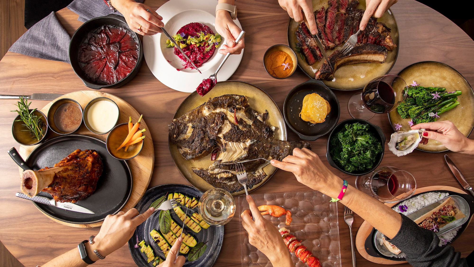 a group of people eating food at a table