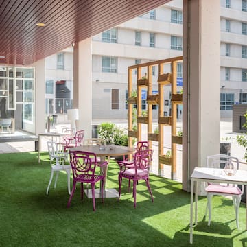 a patio with tables and chairs