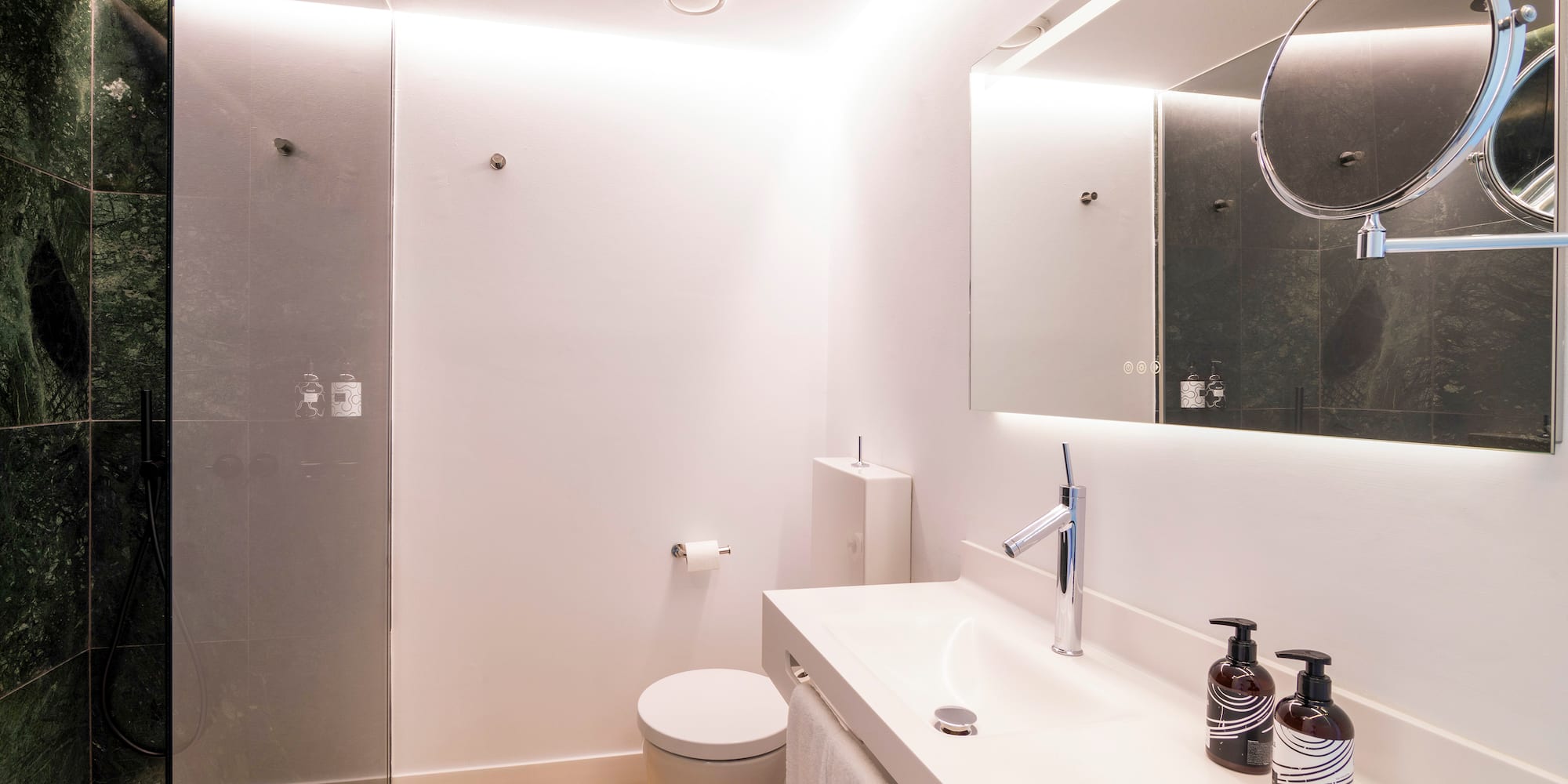 a bathroom with a mirror and sink