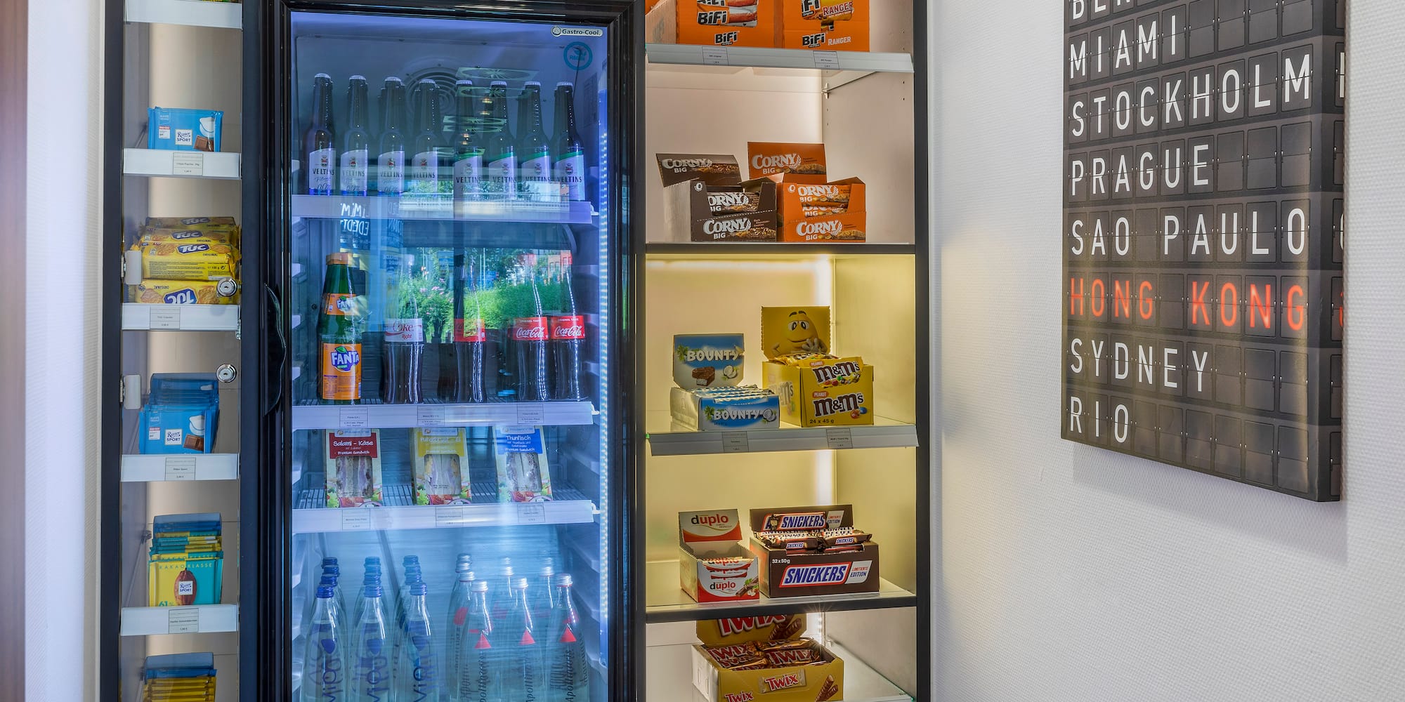 a refrigerator with drinks and snacks