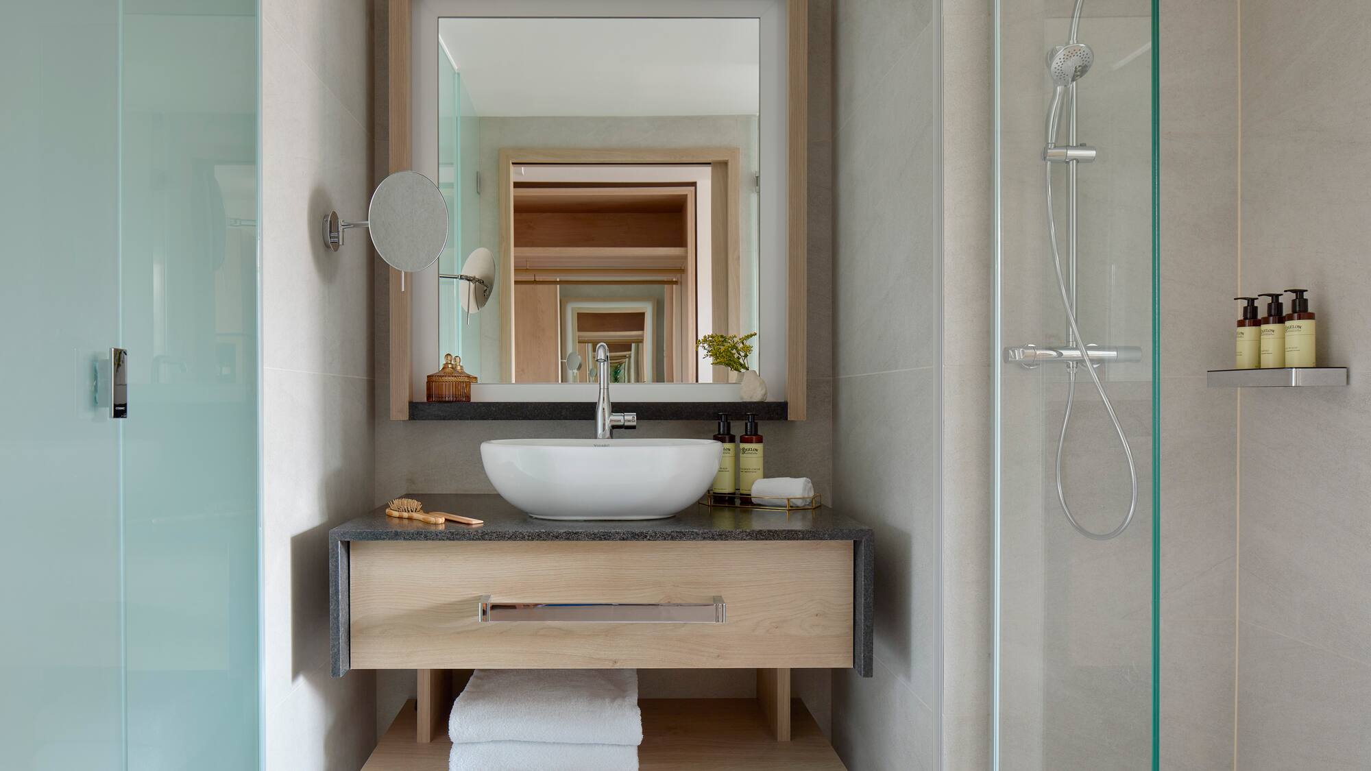 a bathroom with a mirror and sink