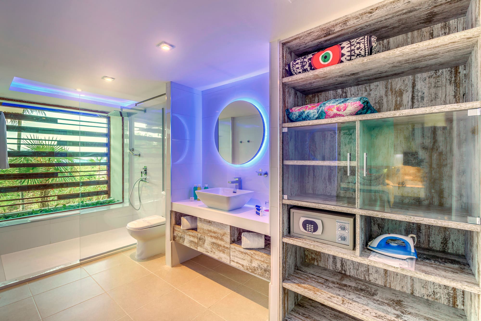 a bathroom with a mirror and shelves