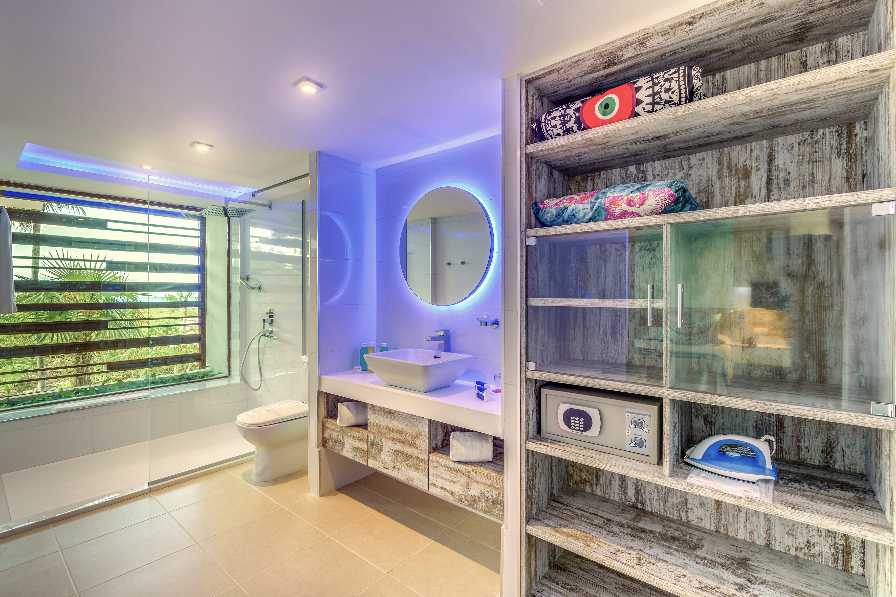 a bathroom with a mirror and shelves