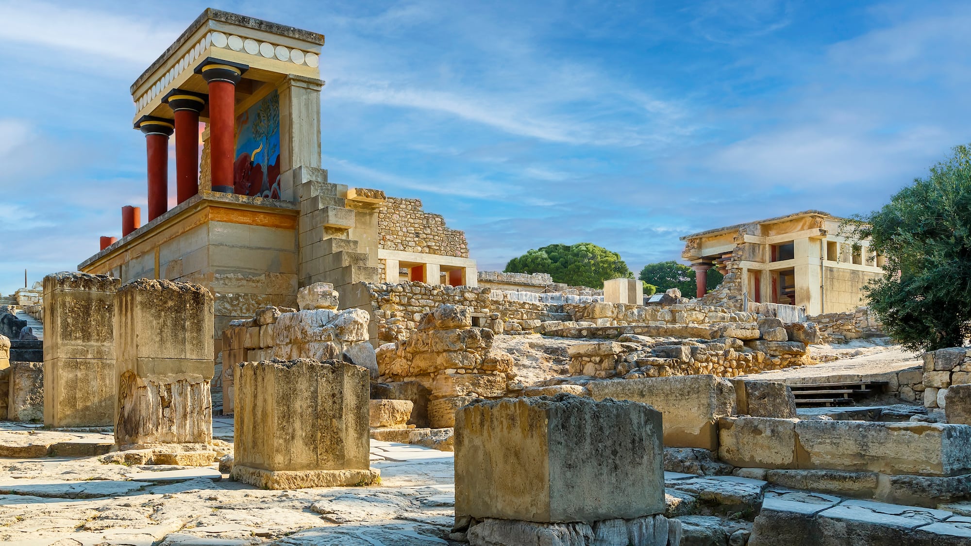 ruins of an ancient building with Knossos in the background