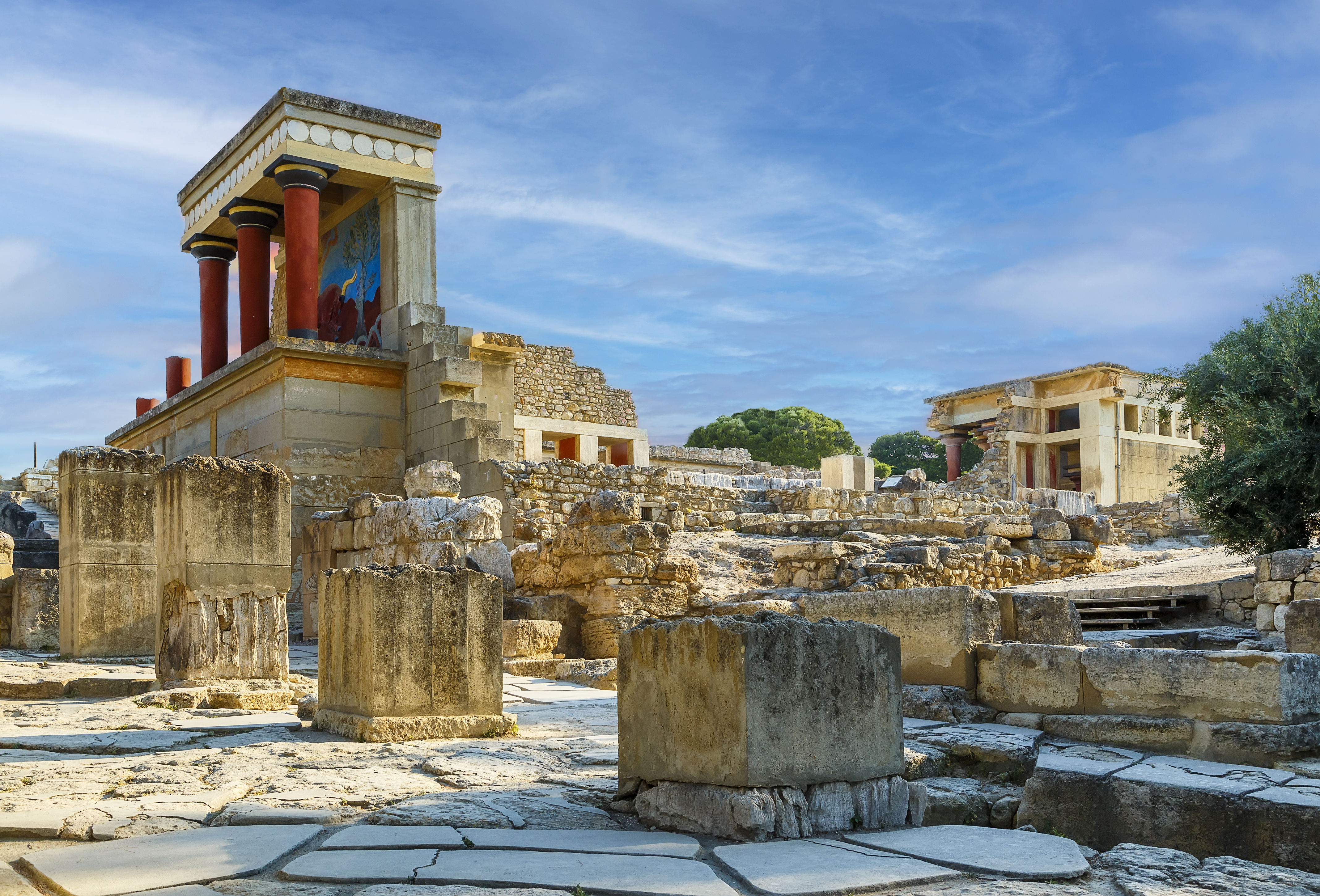 ruins of an ancient building with Knossos in the background