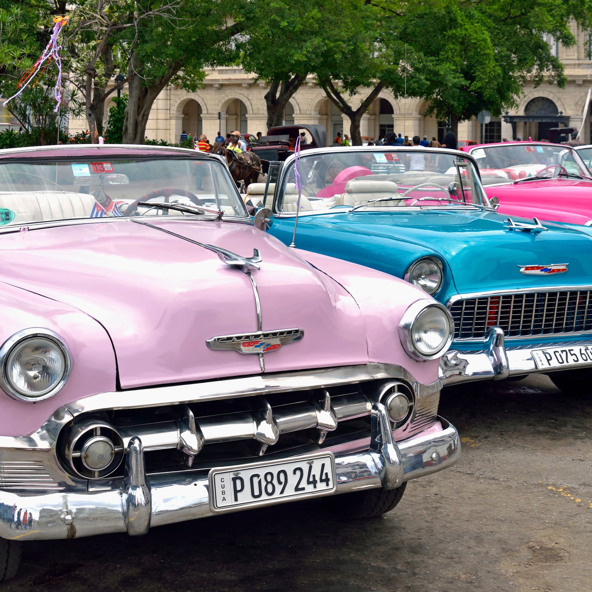 a group of cars parked in a parking lot