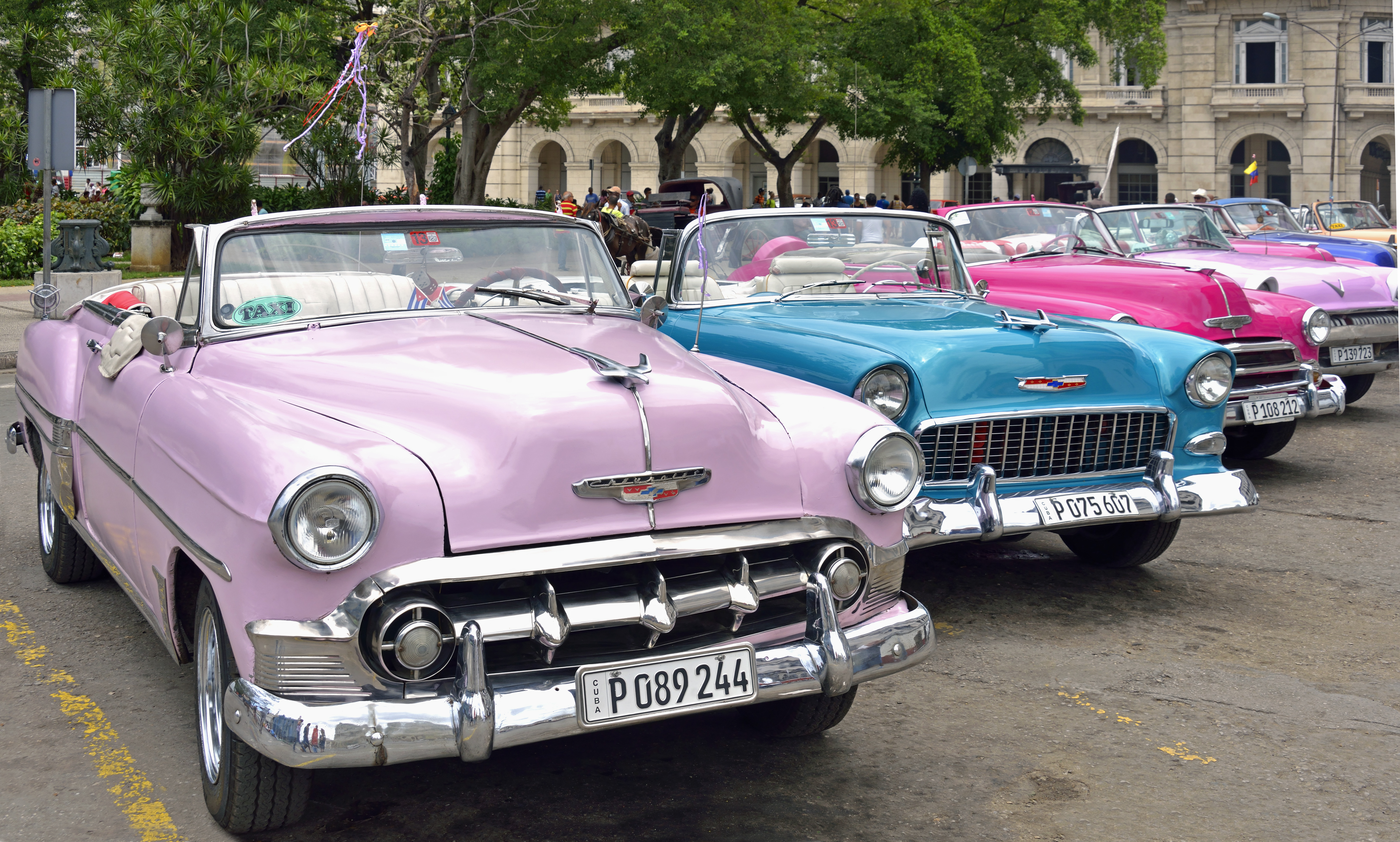 a group of cars parked in a parking lot