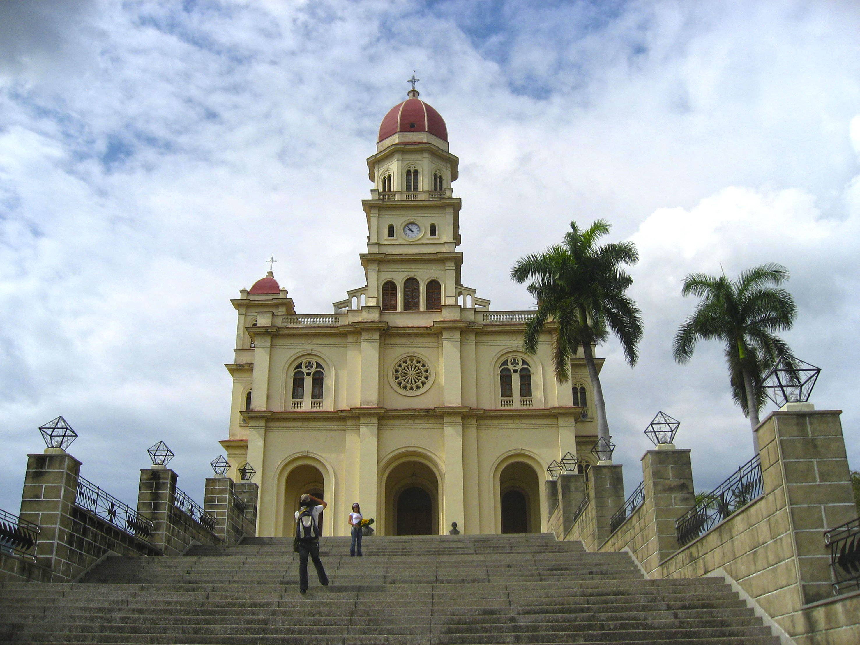 a building with a red dome and a red roof