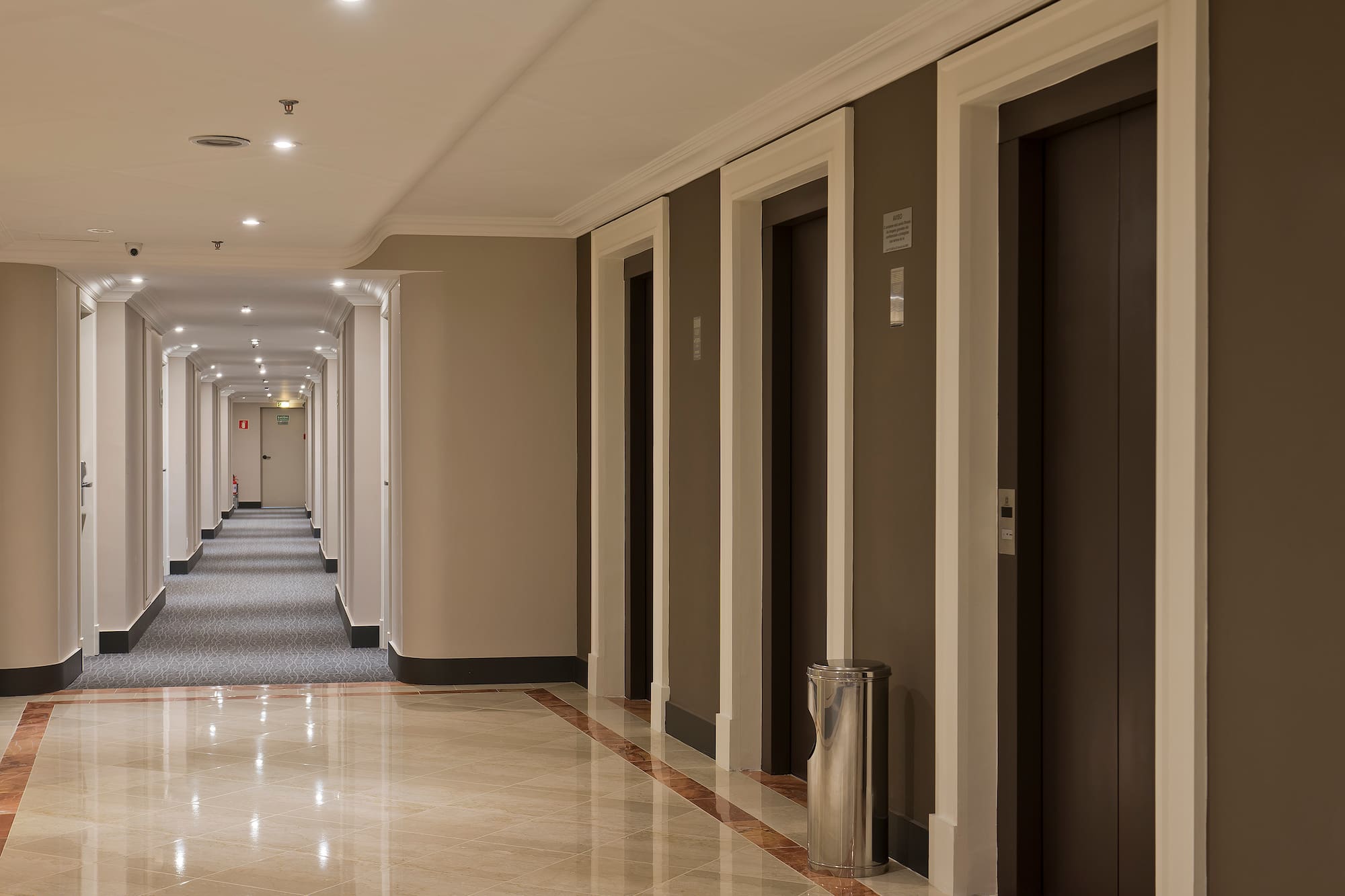 a hallway with several doors