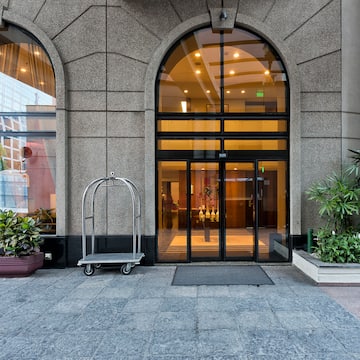a building with arched windows and a cart