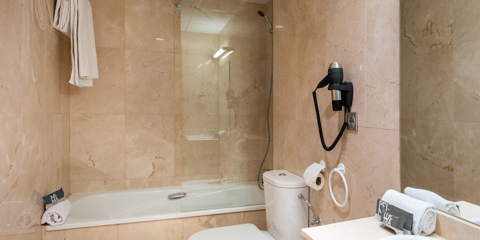 a bathroom with a glass shower door