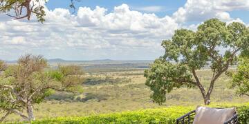 a patio with chairs and a table