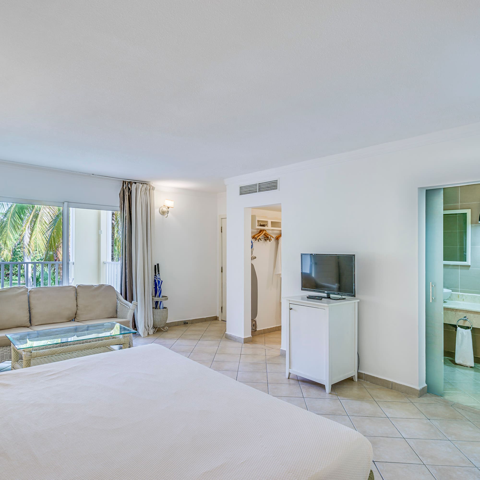 a room with a television and a bed