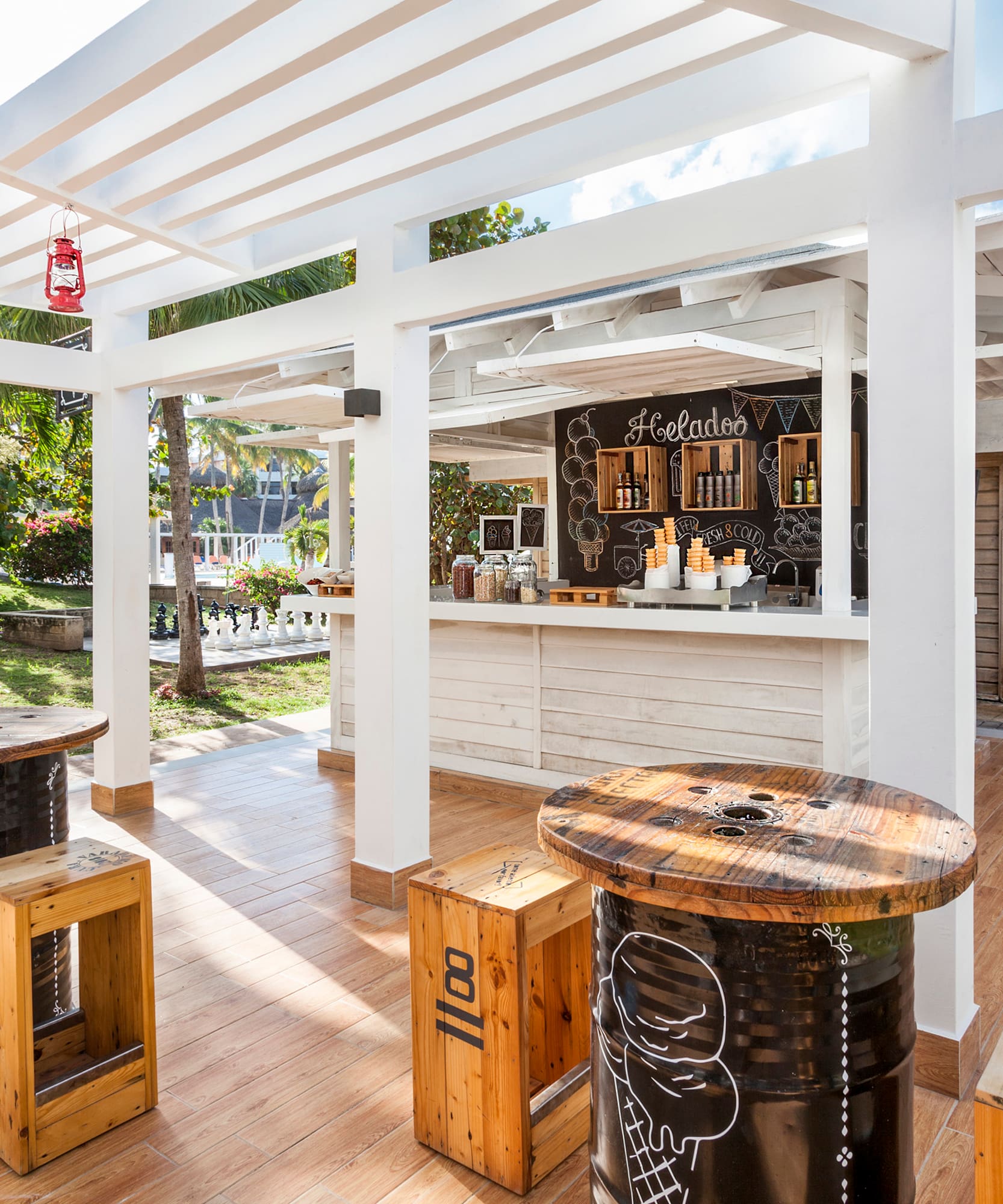 a patio with tables and chairs